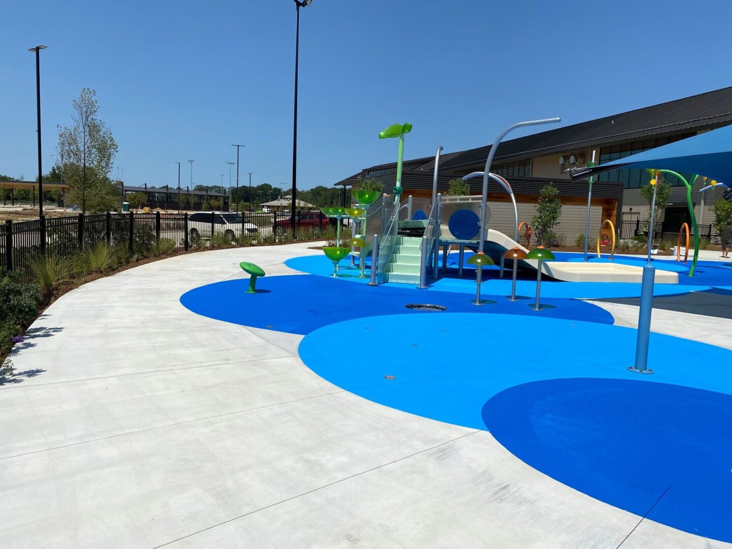 A playground with blue and white tiles in the middle of it.