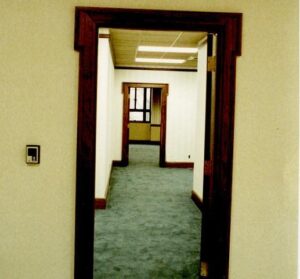 Doorway leading to carpeted hallway.