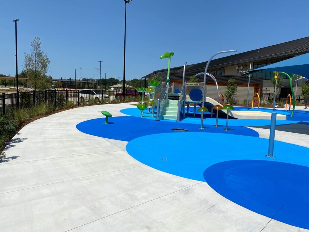 Splash pad with blue and green features.