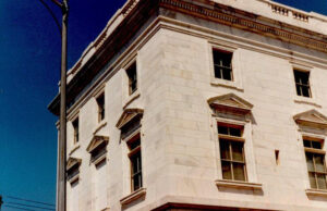 A white building with multiple windows.