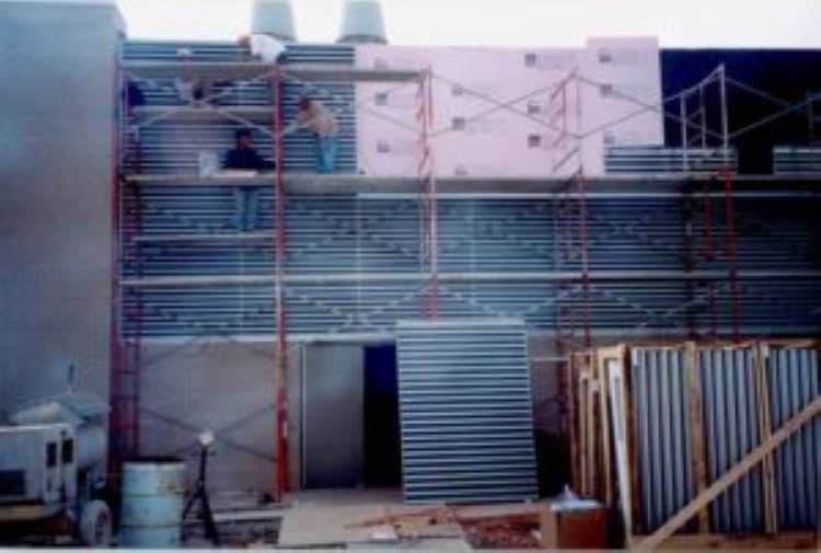 Scaffolding with workers on a building renovation.